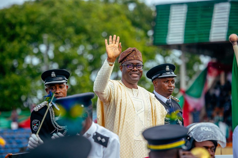 Governor Seyi Makinde waves to the crowd during Inspection of Guards on Inauguration Day
